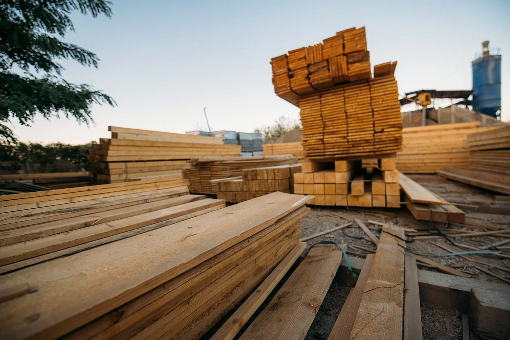 Stacked floorboard planks in random lengths at a lumber yard