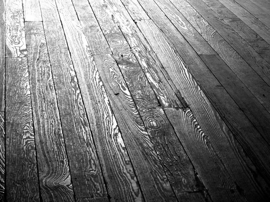 Hardwood floorboards of different widths laid side by side