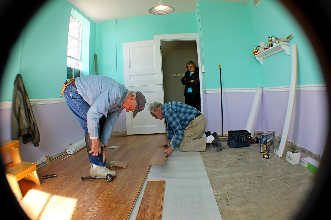 SPC Vinyl Plank Flooring (2026): Rigid Core Done Right Close-up of rigid plank flooring being assembled seam to seam