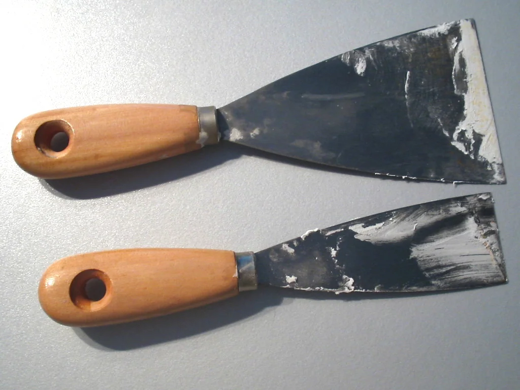 Two putty knives with flexible blades