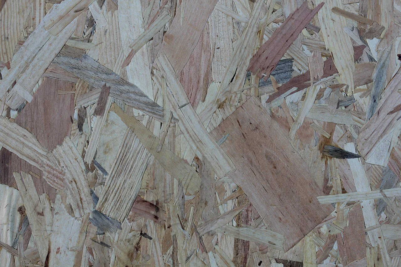 How to Seal a Subfloor (2026): Stop Moisture Before It Starts Close-up of an OSB subfloor panel surface